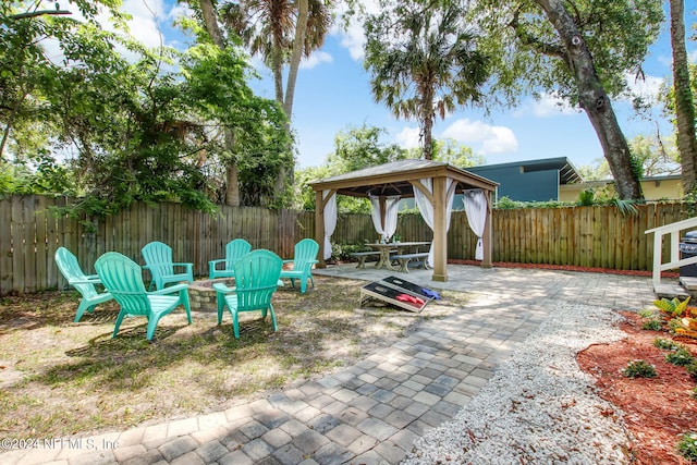 view of patio featuring a fenced backyard and a gazebo