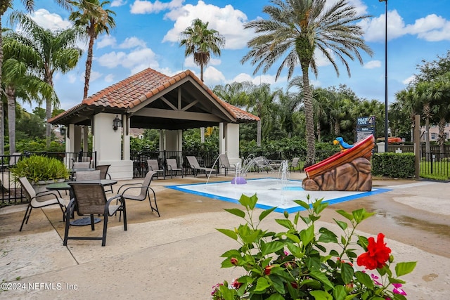 view of swimming pool with a gazebo and a patio area