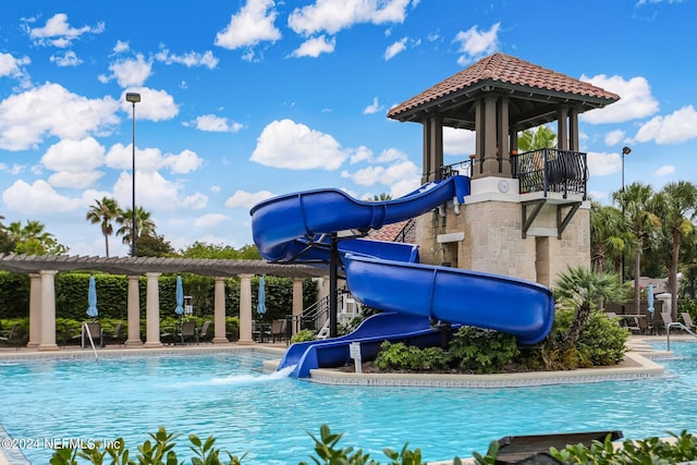 view of pool featuring a water slide