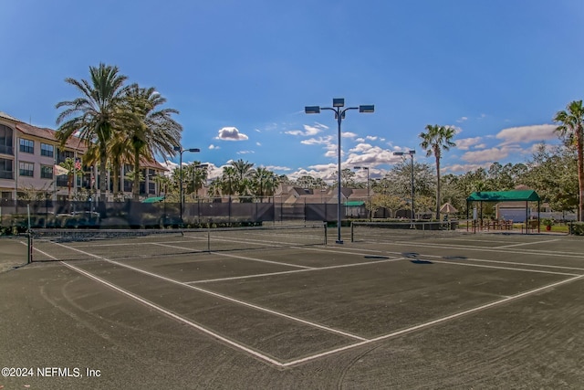 view of sport court with fence