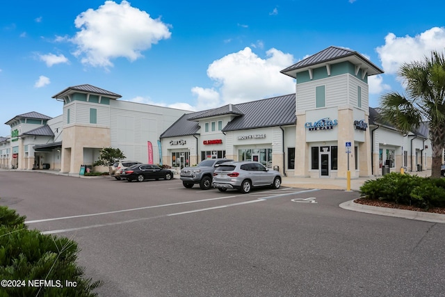 view of property featuring uncovered parking