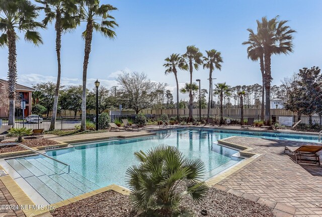 view of swimming pool with a patio