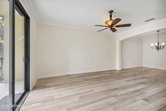 unfurnished room featuring ceiling fan with notable chandelier, light hardwood / wood-style floors, crown molding, and a wealth of natural light