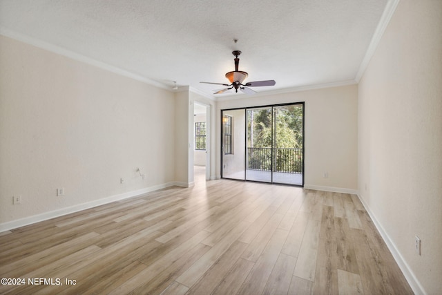 spare room featuring a textured ceiling, light wood-style flooring, a ceiling fan, baseboards, and ornamental molding