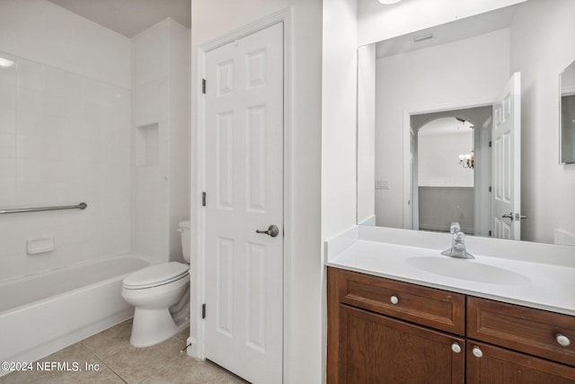 bathroom featuring shower / washtub combination, vanity, toilet, and tile patterned floors