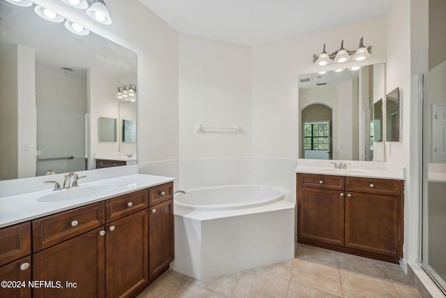 bathroom featuring tile patterned flooring, vanity, and independent shower and bath