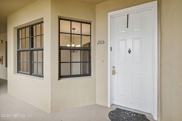 doorway to property with stucco siding