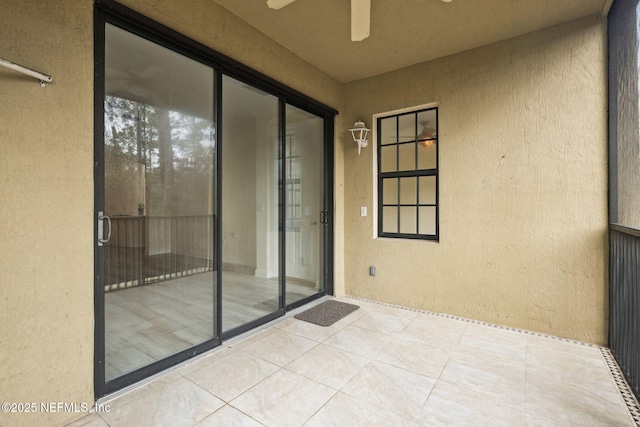 exterior space featuring ceiling fan