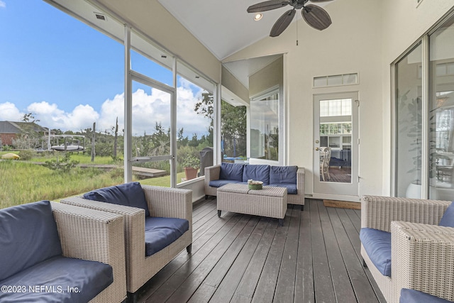 sunroom featuring ceiling fan