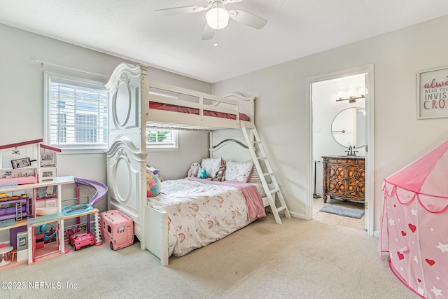 bedroom with ceiling fan and light colored carpet