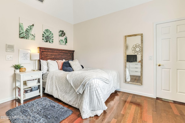 bedroom with hardwood / wood-style floors