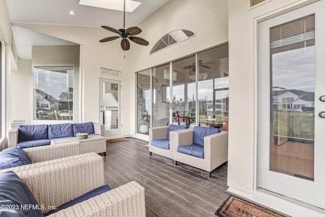 sunroom / solarium featuring ceiling fan and lofted ceiling