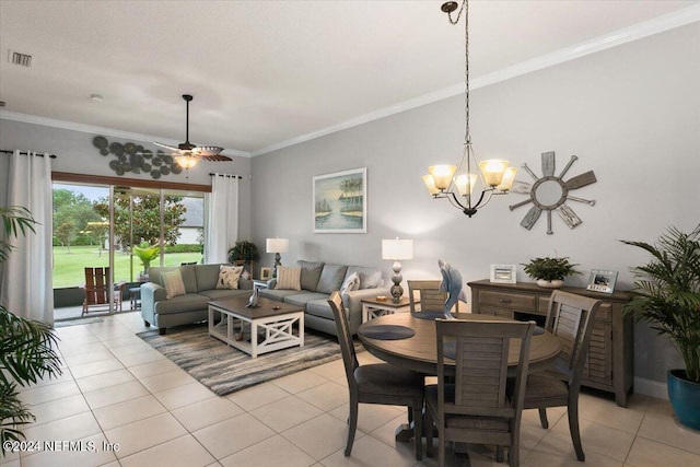 dining room with light tile patterned floors, ceiling fan with notable chandelier, and crown molding