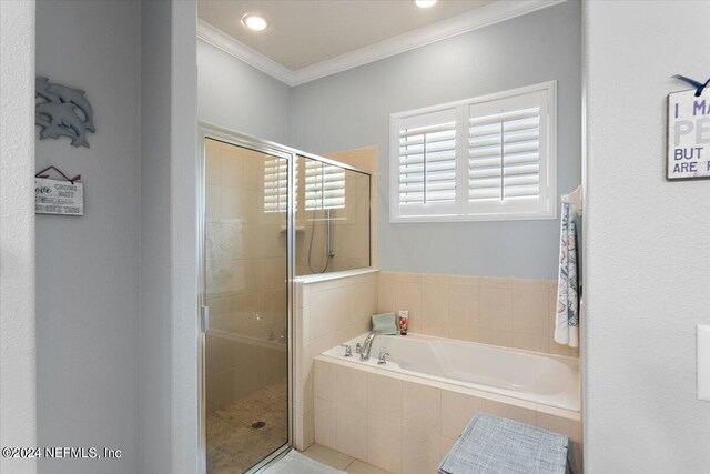 bathroom with independent shower and bath and crown molding