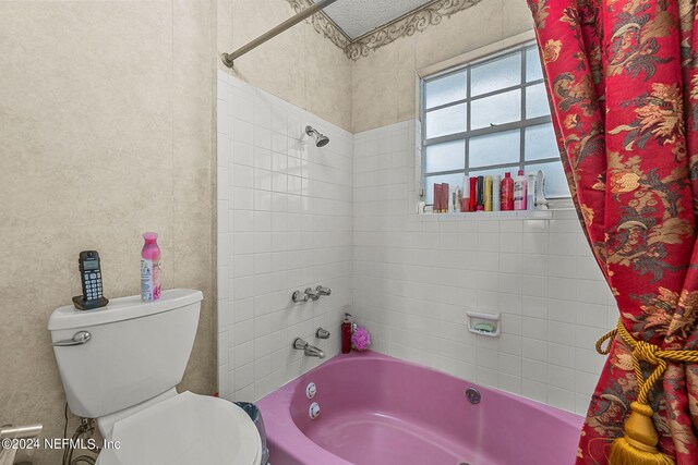 bathroom with toilet and shower / bathtub combination with curtain