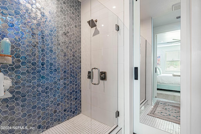 ensuite bathroom with a stall shower and ensuite bathroom