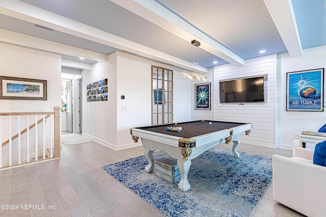 recreation room featuring billiards, baseboards, wood finished floors, and beam ceiling