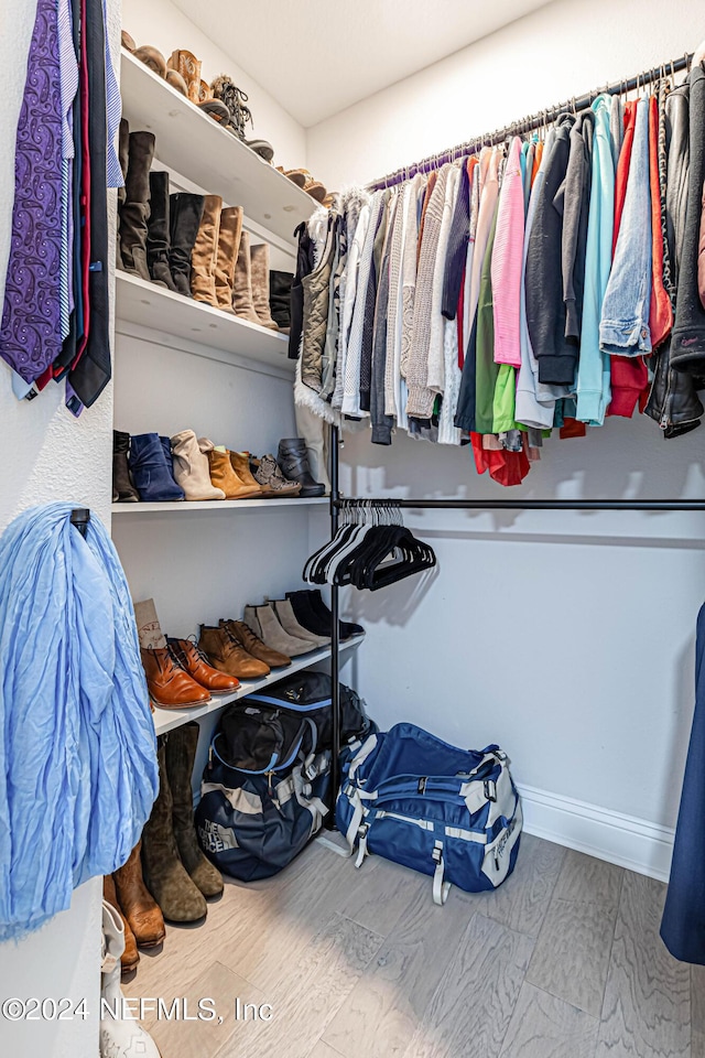 spacious closet with wood finished floors