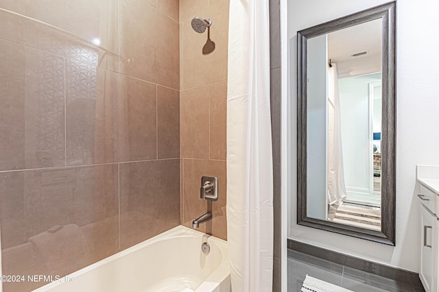 bathroom with shower / tub combo with curtain and vanity