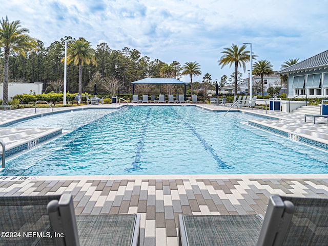 community pool with a patio area