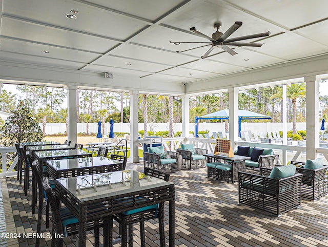 view of patio featuring an outdoor hangout area, outdoor dining area, a fenced backyard, and ceiling fan