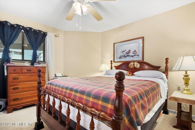 bedroom featuring ceiling fan and carpet flooring