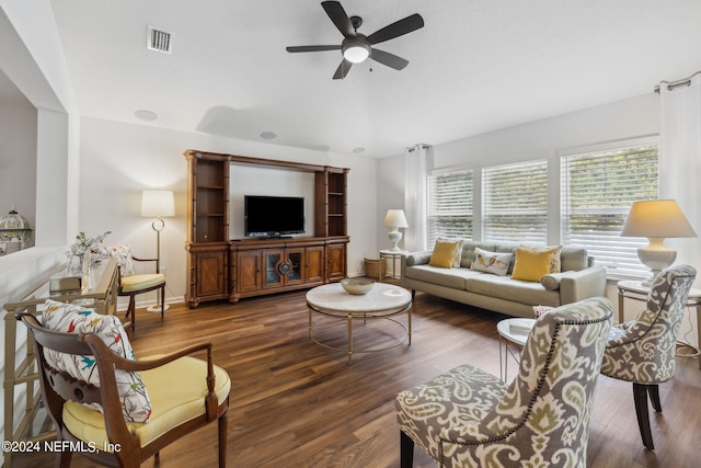 living area with visible vents, ceiling fan, and wood finished floors