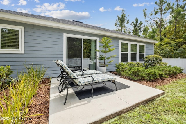 view of patio featuring fence