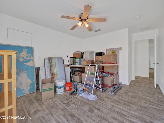 home office featuring ceiling fan and light hardwood / wood-style floors