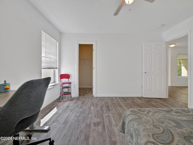 office area with hardwood / wood-style floors and ceiling fan