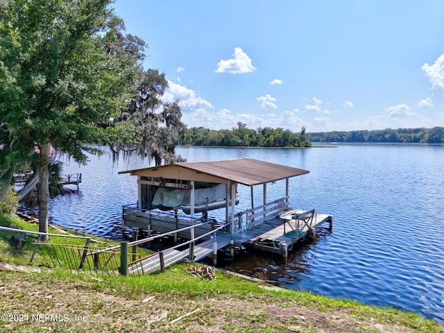 view of dock featuring a water view and boat lift