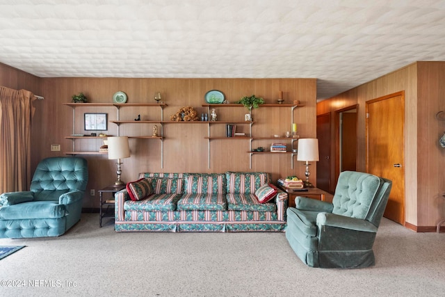 living room with wood walls and a textured ceiling