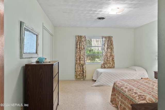 bedroom with a textured ceiling