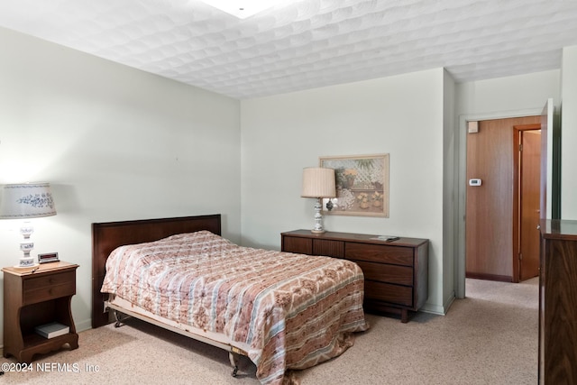 bedroom with light carpet