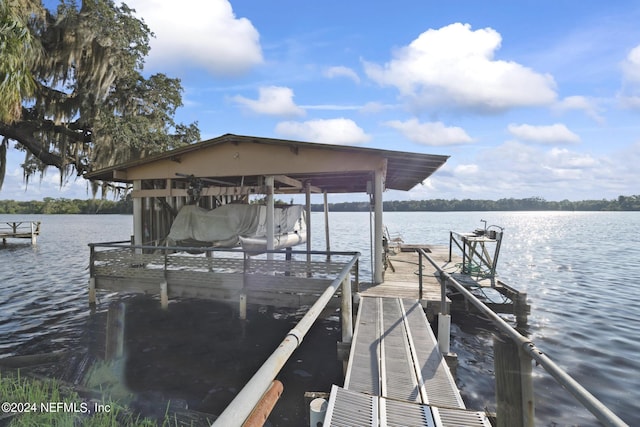 view of dock with a water view and boat lift