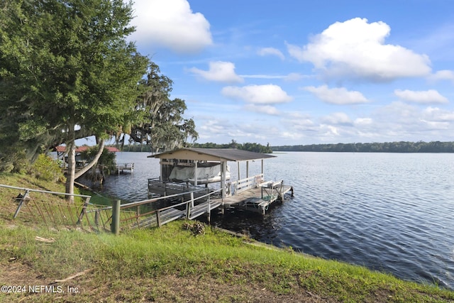 view of dock featuring a water view and boat lift