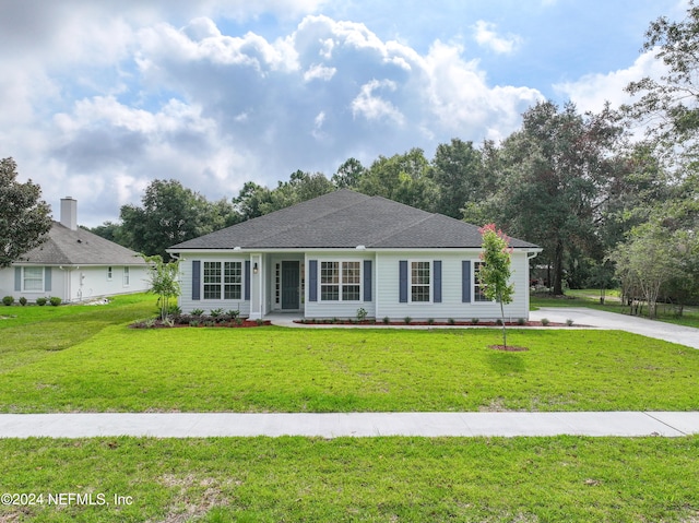 ranch-style home featuring a front yard