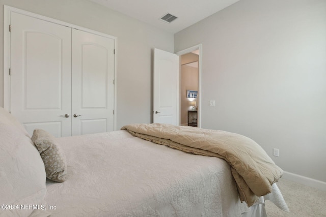 bedroom with a closet and carpet