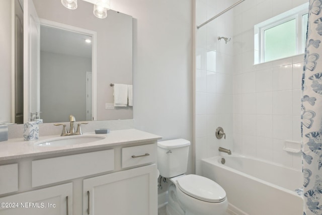 full bathroom featuring vanity, shower / tub combo, and toilet