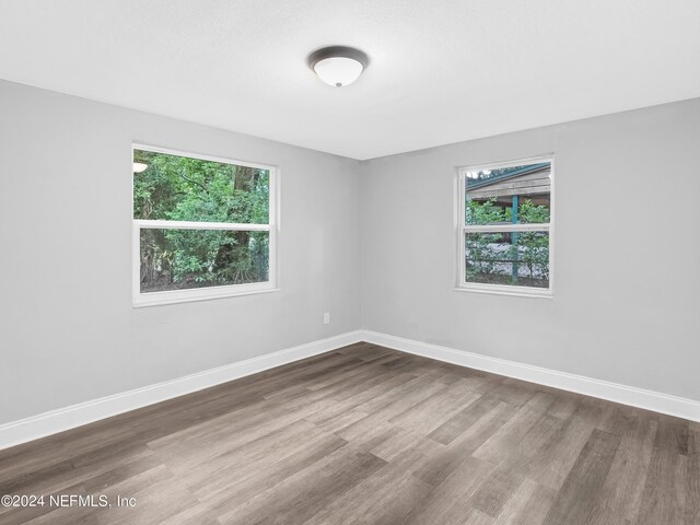 unfurnished room featuring wood-type flooring