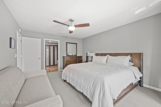 bedroom featuring a textured ceiling and ceiling fan