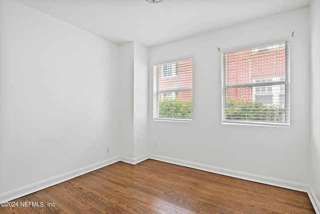 spare room with hardwood / wood-style floors