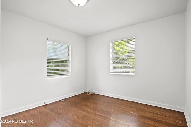 unfurnished room featuring wood-type flooring