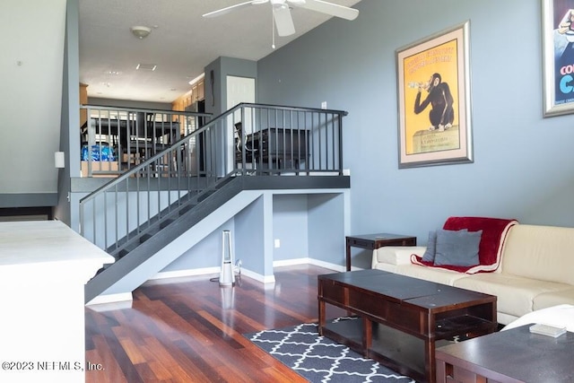 staircase featuring hardwood / wood-style flooring and ceiling fan