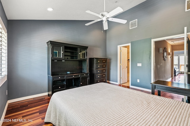 bedroom featuring high vaulted ceiling, hardwood / wood-style flooring, and ceiling fan