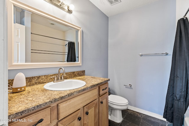 bathroom with a shower with shower curtain, toilet, a textured ceiling, and vanity