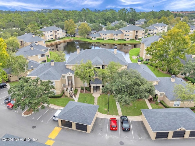 aerial view with a water view and a residential view