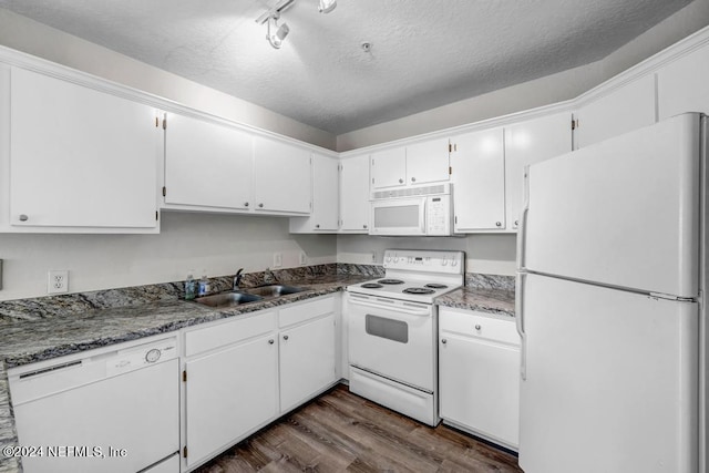 kitchen with white appliances, dark wood-type flooring, a textured ceiling, white cabinetry, and a sink