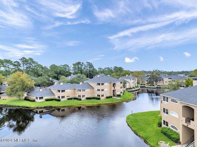 birds eye view of property featuring a water view and a residential view