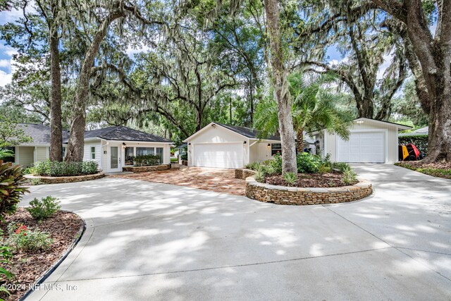 single story home featuring a garage